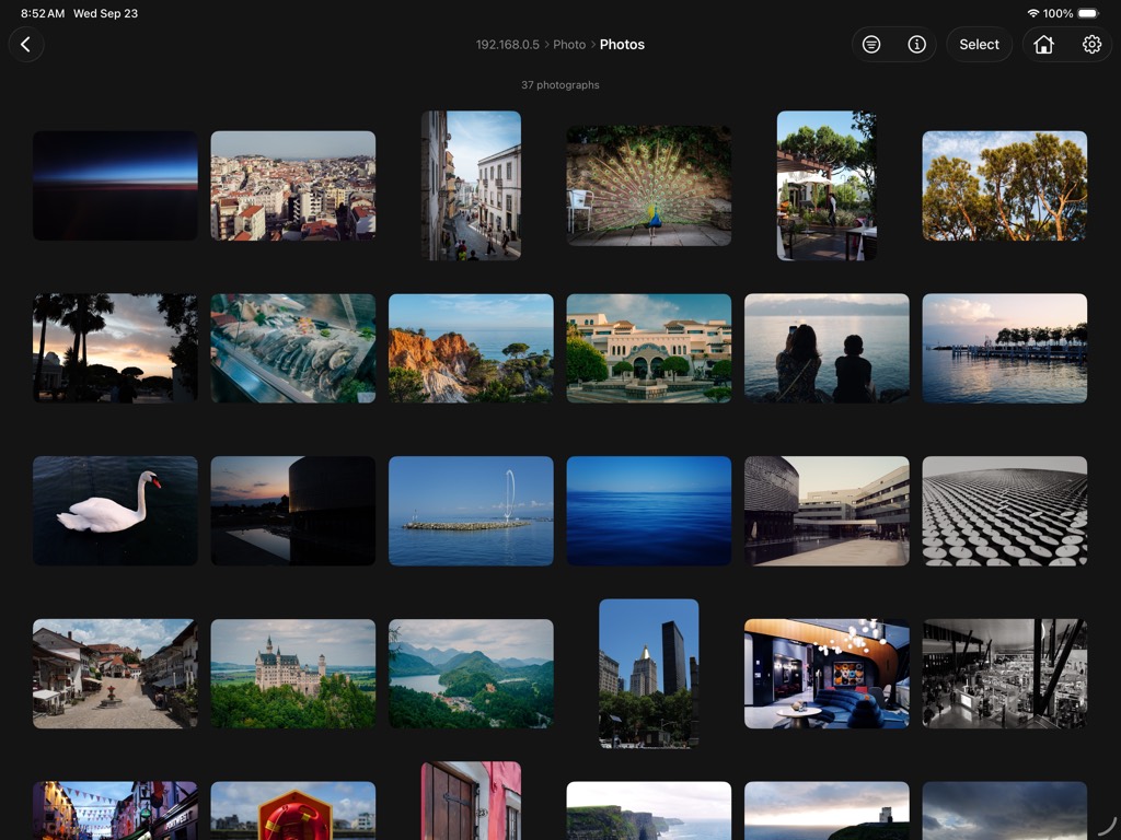 Baryta on iPad, in landscape. A grid of photographs under the folder's name.